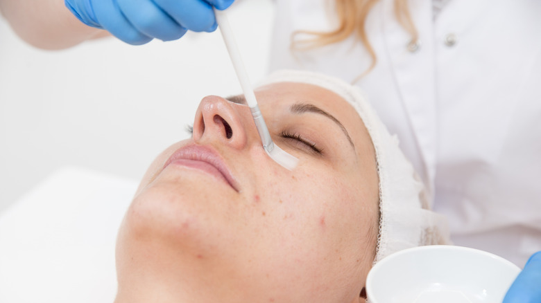 Woman having a chemical peel treatment