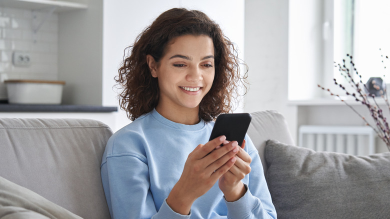 woman looking at phone.