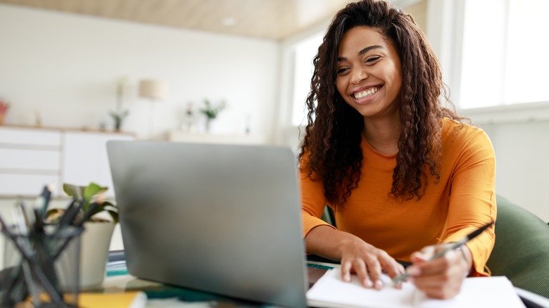 woman researching on her laptop.