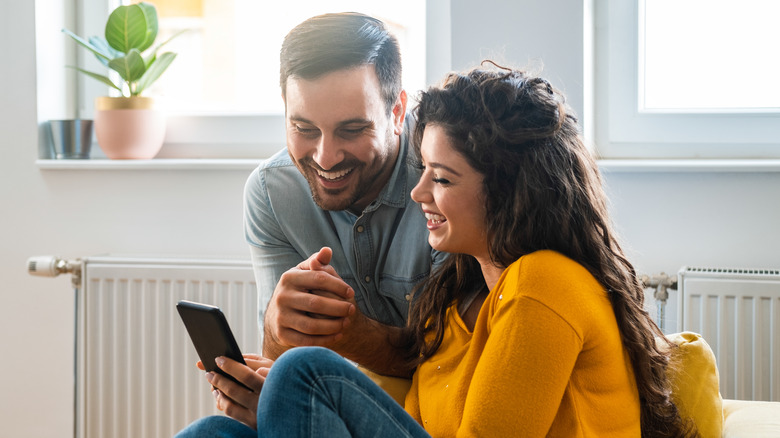 Couple looking at phone