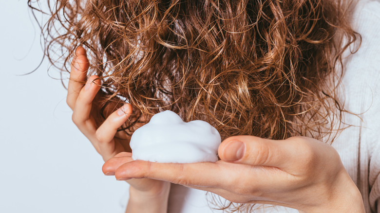 Woman with styling mousse