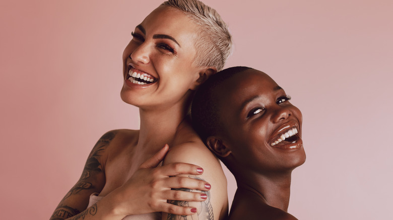 Two people with pixie cuts