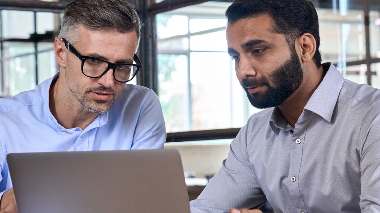 two employees having a discussion