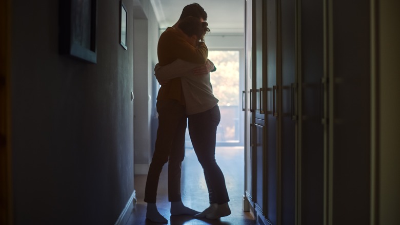 Man and woman embrace