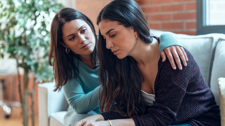 A woman supporting her friend