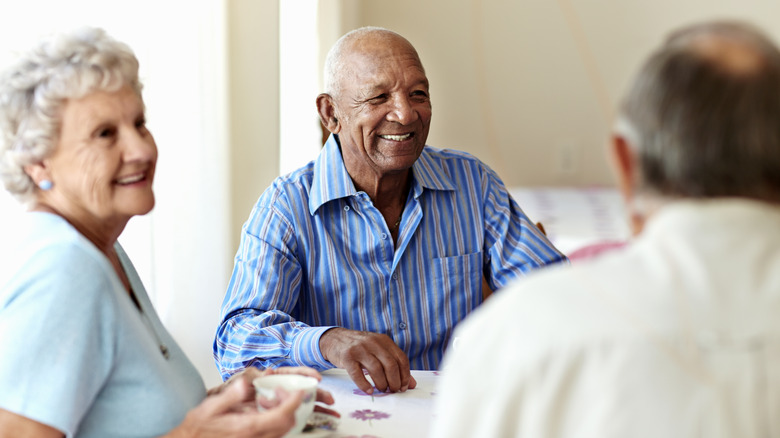Group of people speaking at table