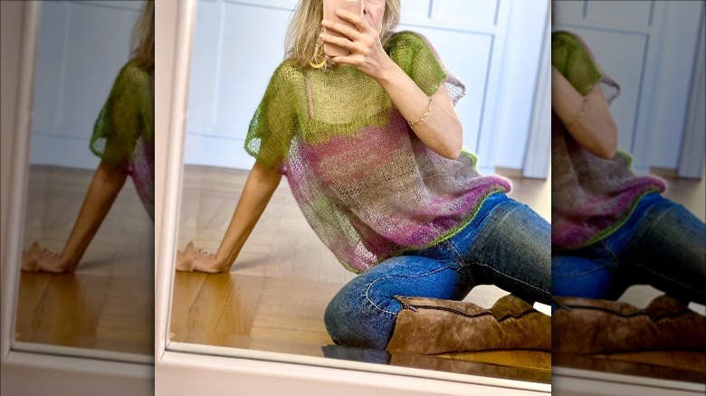 Girl taking selfie in unique mohair top.