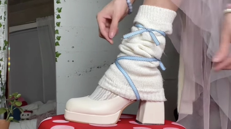 Ribbon tied around leg warmers