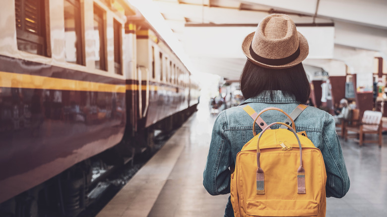 Young woman on train platform