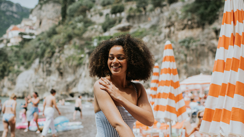 Woman applying sunscreen