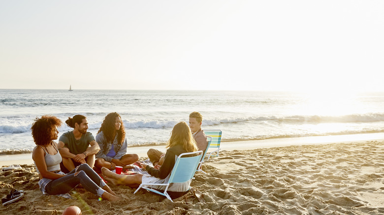 friends hanging out on the beach