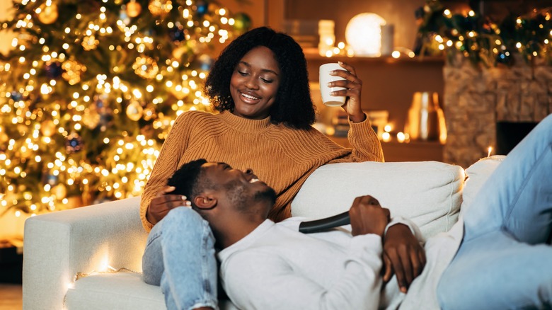 woman on couch with partner