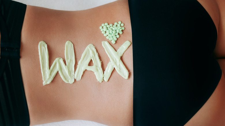 wax written on woman's back