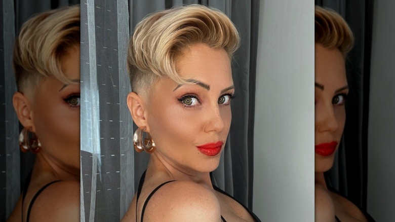 woman with gold hoop earrings