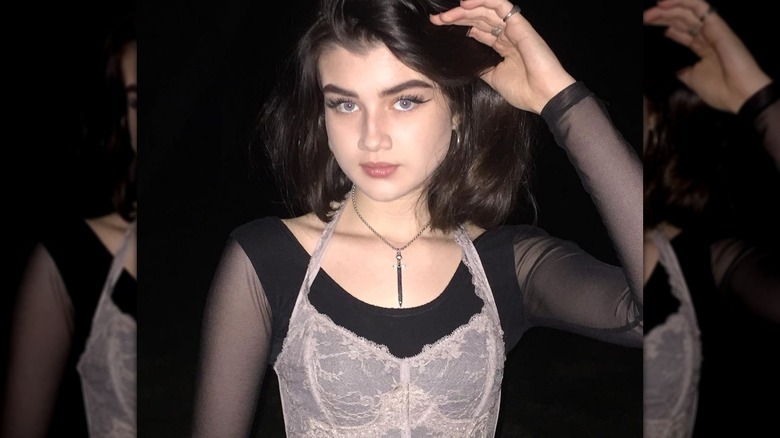 woman with necklace posing