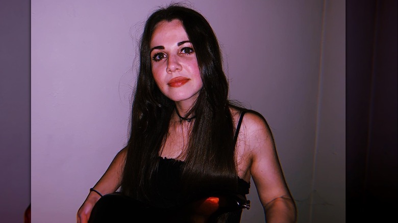 woman with guitar and brown hair