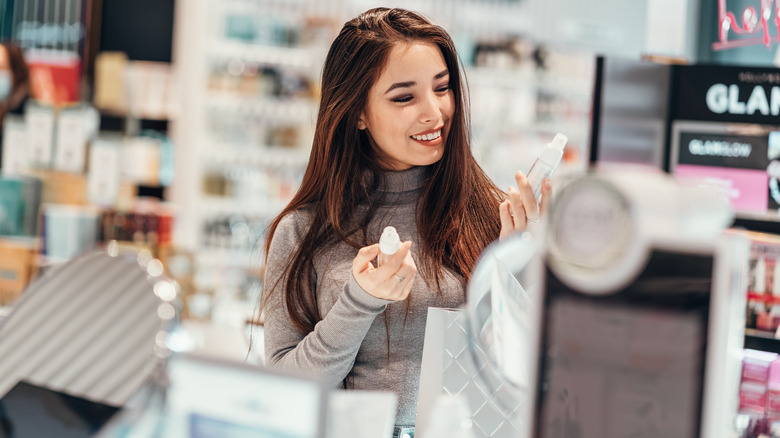 Woman makeup shopping