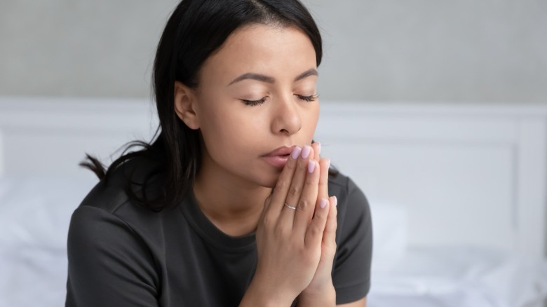 Woman in the prayer position