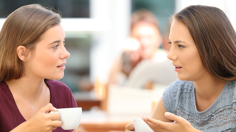 two friends talking seriously