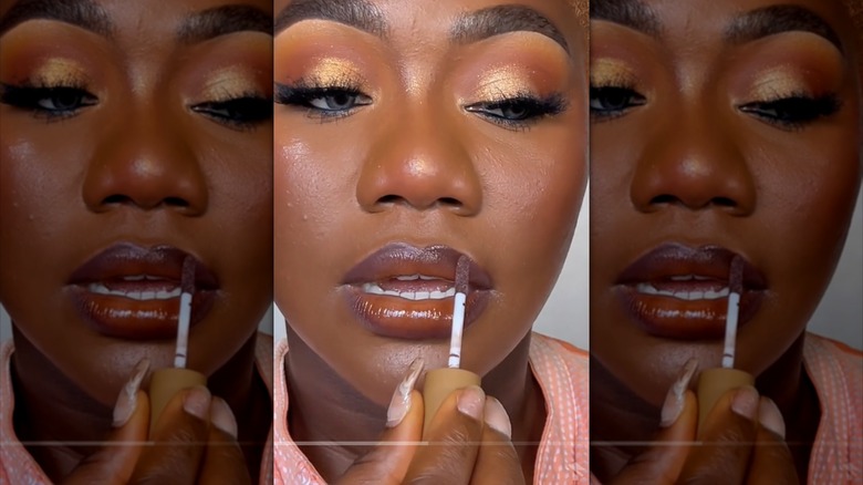 woman applying ombré lip