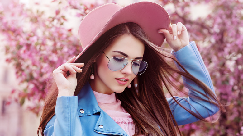 Woman wearing hat and glasses
