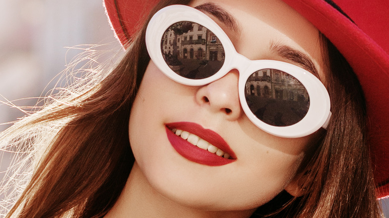 Woman wearing oval glasses