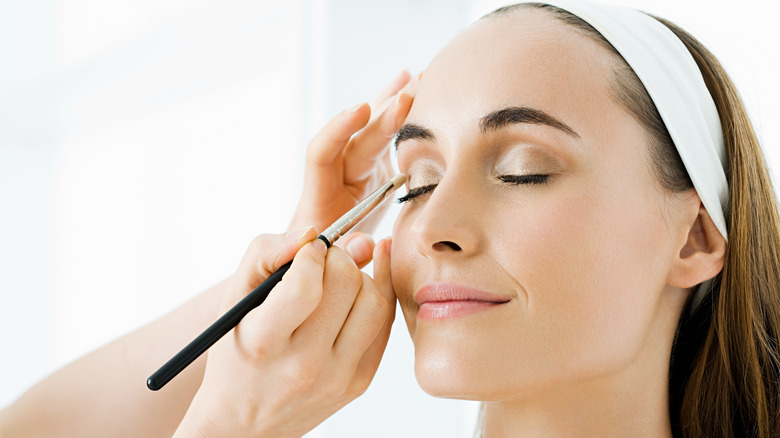 Woman getting her makeup done