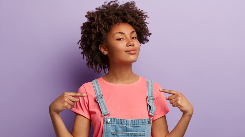 Self assured woman pointing