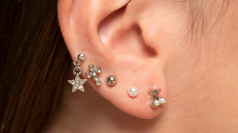 ear with silver jewelry 