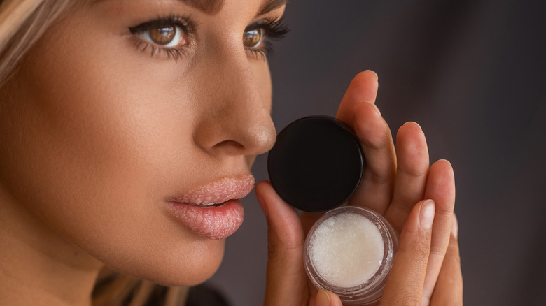 Woman using a lip scrub