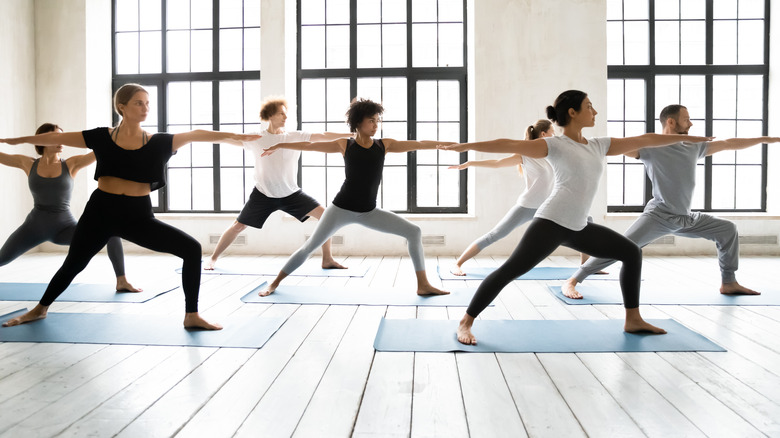 People participating in yoga class
