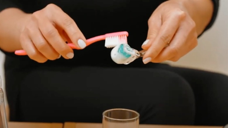 Derma roller in a glass of soap water