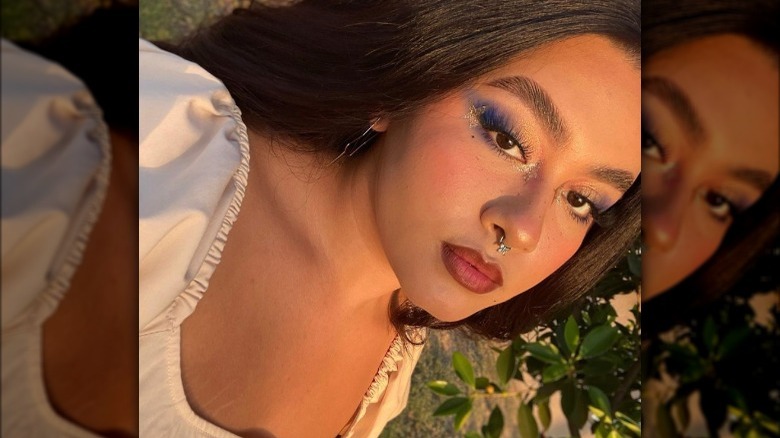 Latina girl wearing gold highlighter