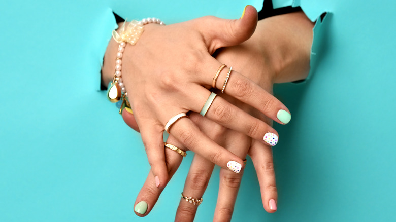 Hands featuring multiple rings