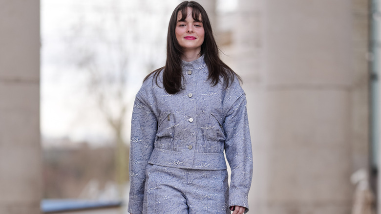 Woman wearing a matching jacket and shorts