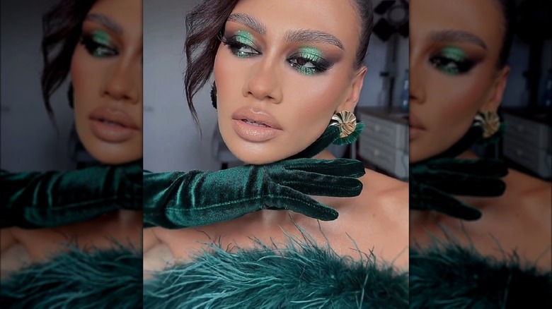 A woman with green makeup