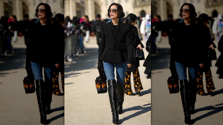 Over-the-knee boots and jeans