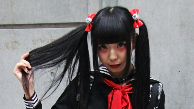 person with red under-eye makeup