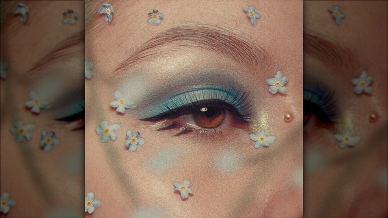 person with eyeliner flicks