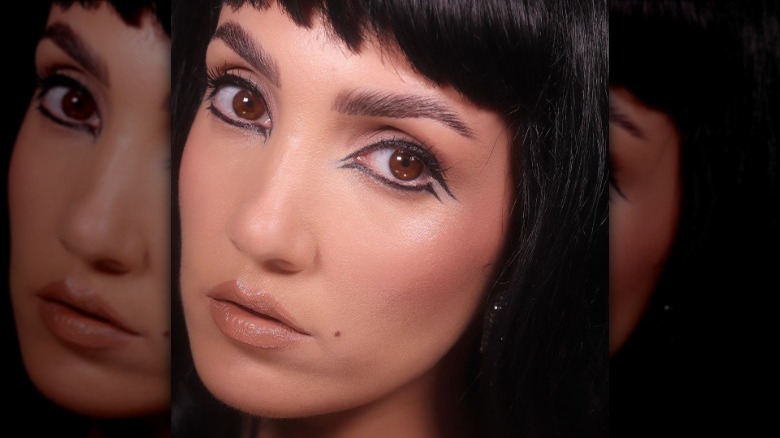 person wearing downturned eyeliner