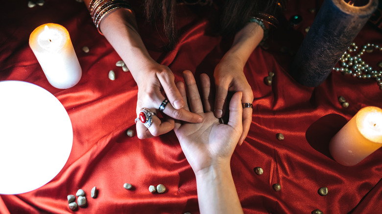 palm reader pointing at love line