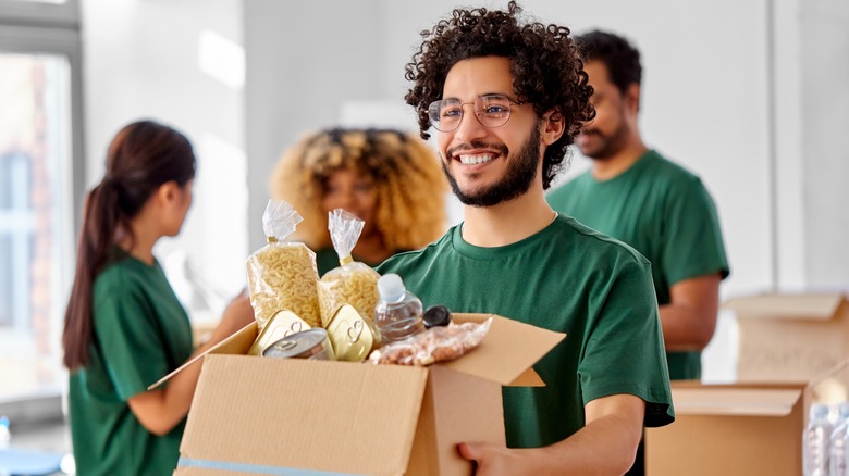 Man volunteering at a food pantry
