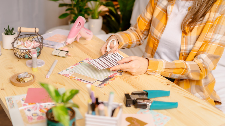 woman making a scrapbook