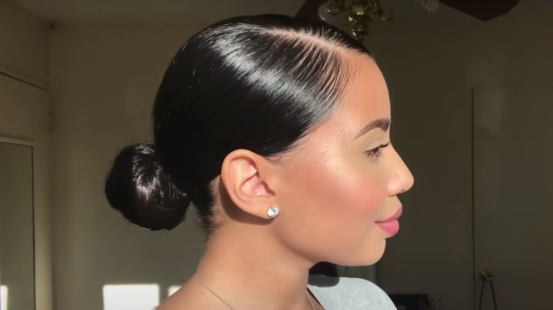 Dark-haired woman sleek bun