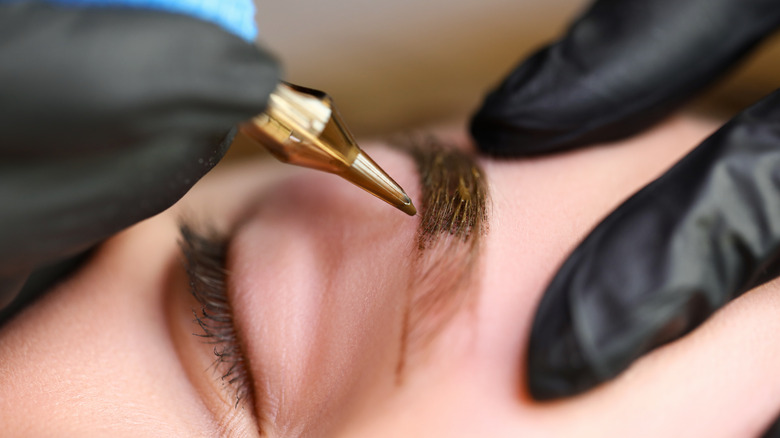 Woman getting microblading