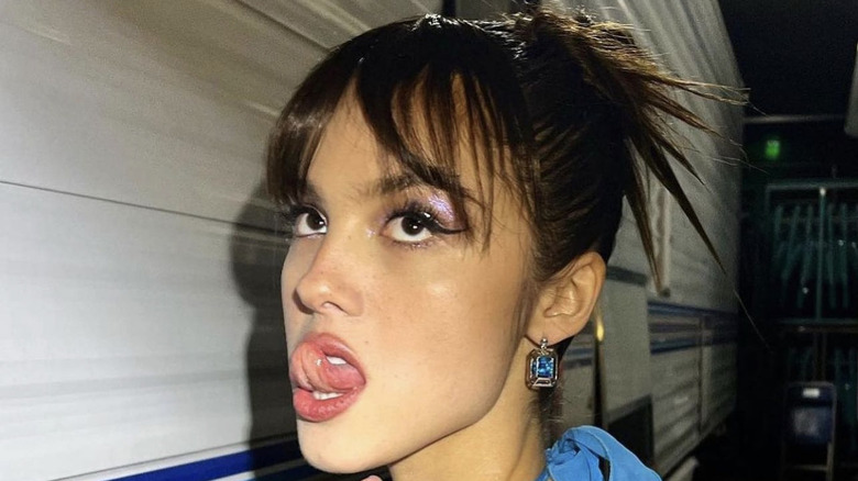 Woman with spiked bangs and spiked bun