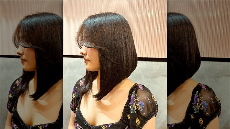 woman with curtain bangs bob