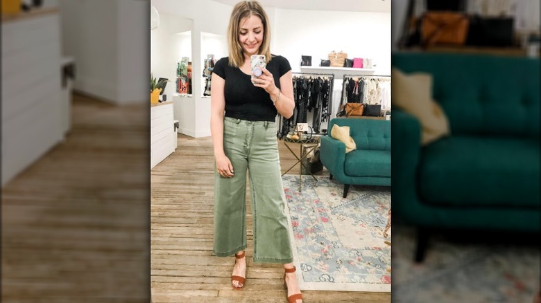Woman wearing green wide leg pants