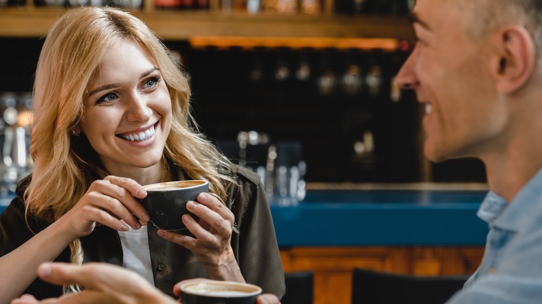 two people drinking coffee