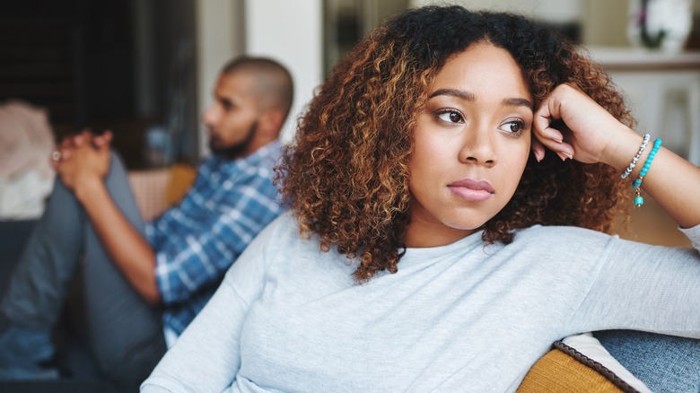 Tired couple on a couch
